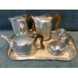 A Picquot Ware tea/coffee set, the five stylised pieces with wood handles on rectangular tray. (6)