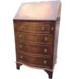A Chapman bowfronted mahogany bureau, the crossbanded fallfront enclosing a fitted interior with