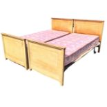 A pair of Edwardian mahogany 3ft single beds with moulded rails to crossbanded headboards &