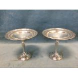 A pair of American sterling silver comports, by Ellmore Silver Co, the bowls with rolled rims,
