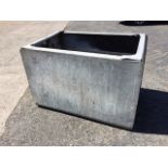 A galvanised rounded tank with flat rim. (35.25in x 24in x 24.5in)