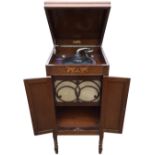 A 1930s oak cased cabinet gramophone by Yagerphone, with speaker and record compartment below a