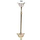 A Victorian adjustable brass oil standard lamp, the cut glass Messengers Patent reservoir above a