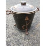 An arts & crafts copper fireside box of tapering bucket form embossed with art nouveau style motifs,