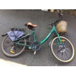 A Regency Freego electric bike with sprung seat, cane pannier, luggage rack, Tektro brakes,