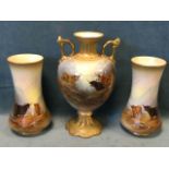 A Crown Devon garniture decorated with highland cattle in landscape by G Cox, with pair of waisted