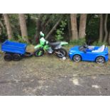 A childs electric motorbike with stabilising wheels; an electric childs car - an Audi model; and a