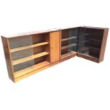 A Herbert Gibb mahogany glazed bookcase in two sections, with a corner unit and rectangular cabinet,