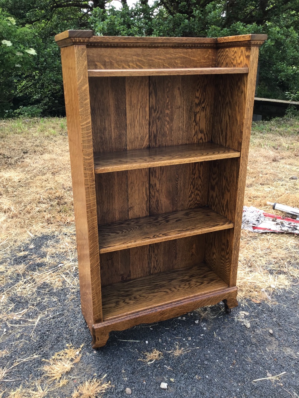 An arts & crafts Gustav Stickley style oak bookcase with moulded egg-and-dart cornice above four - Image 2 of 3