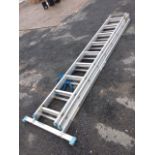 A three-section aluminium extending ladder with rectangular ribbed rungs and base support. (98in