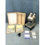 A Vickers electric microscope with twin lenses, light platform, adjustable sights, etc; and a