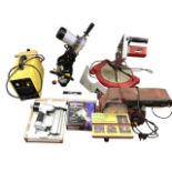 A Power Devil turntable mitre saw; a Rexion bench belt sander; a Cut40 DC inverter air plasma