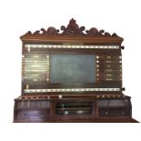 A Victorian Burroughs & Watts snooker scoreboard, with an acanthus scroll carved crest above a