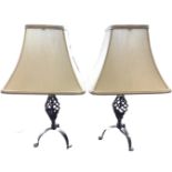 A pair of contemporary tablelamps with rectangular fabric shades on brushed brass pierced twisted