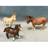 Three Beswick animal figurines - an unglazed fawn-coloured matt glazed donkey, a miniature