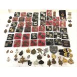 A collection of military cap and collar badges - Royal Army Service Corps, Volunteer War