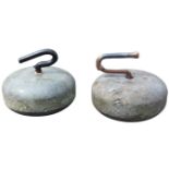 A pair of Victorian granite curling stones with shaped handles, bearing carved initials DB. (