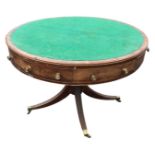 A regency mahogany library table, the baize lined top with boxwood stringing above a frieze with