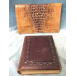 A Victorian leather bound photograph album, with embossed covers, gilt edges and decorative colour