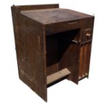 A Victorian mahogany clerks desk with angled hinged lid enclosing an interior with pigeonholes,