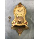 A boxed Louis XV style cartel clock by Eluxa, the waisted gilt case with handpainted floral
