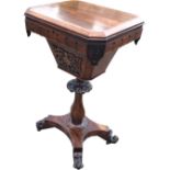 A Victorian rosewood sewing table, the hinged rectangular canted top above an interior with well and