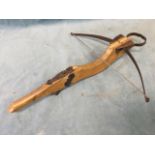 A hardwood crossbow with wire string and metal trigger, mounts and bow - working. (19.5in)