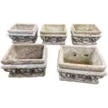 A set of five rectangular composition stone garden troughs, the sides cast with shells and foliate