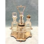 A Hukin & Heath silver plated and cut glass four-piece cruet stand by Christopher Dresser, with