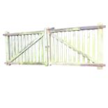 A pair of rectangular garden gates of Z-framed batten construction with iron strap hinges, the