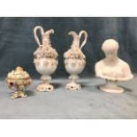 A Victorian parian bust of Clytie; a pair of mid-19th century floral encrusted parian ewers; and