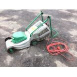 A Qualcast electric garden mower, the Quicktrack model with folding handle and grassbox.