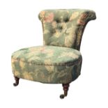 A Victorian walnut button upholstered chair with flared scrolled back above a rounded sprung seat,