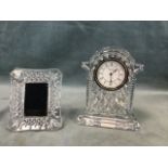 A Waterford Crystal glass mantel clock of arched architectural form with ribbed case on stepped