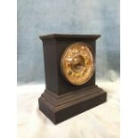 A Victorian cast iron mantle clock in architectural style case on moulded plinth, the brass dial