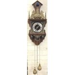 A Georgian style wallclock with atlas figure above bell framed by pierced brass gallery, the dial