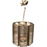 A large contemporary octagonal metal and glass hall lantern, the frame with brushed patina, fitted