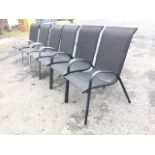 A set of six contemporary garden chairs with fabric backs & seats, having shaped arms and