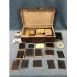 A case of miscellaneous glass photographic plates, many still sealed in boxes, some with images,
