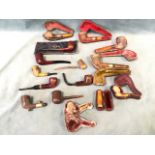 A collection of smoking pipes - briar, meerschaum, several leather cased, carved, some silver