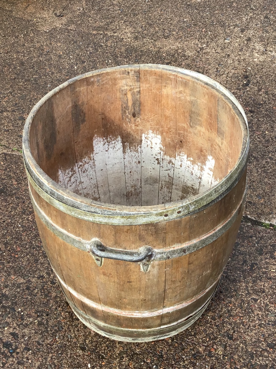 A coopered oak log barrel with iron hoops and carrying handles. (21in x 22in) - Image 3 of 3