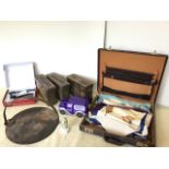 A leather attaché case containing three masonic aprons, a boxed corkscrew, three machine gun