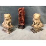 A pair of Chinese carved soapstone Fo dogs on plinths - 7.5in; and a carved soapstone figure of a