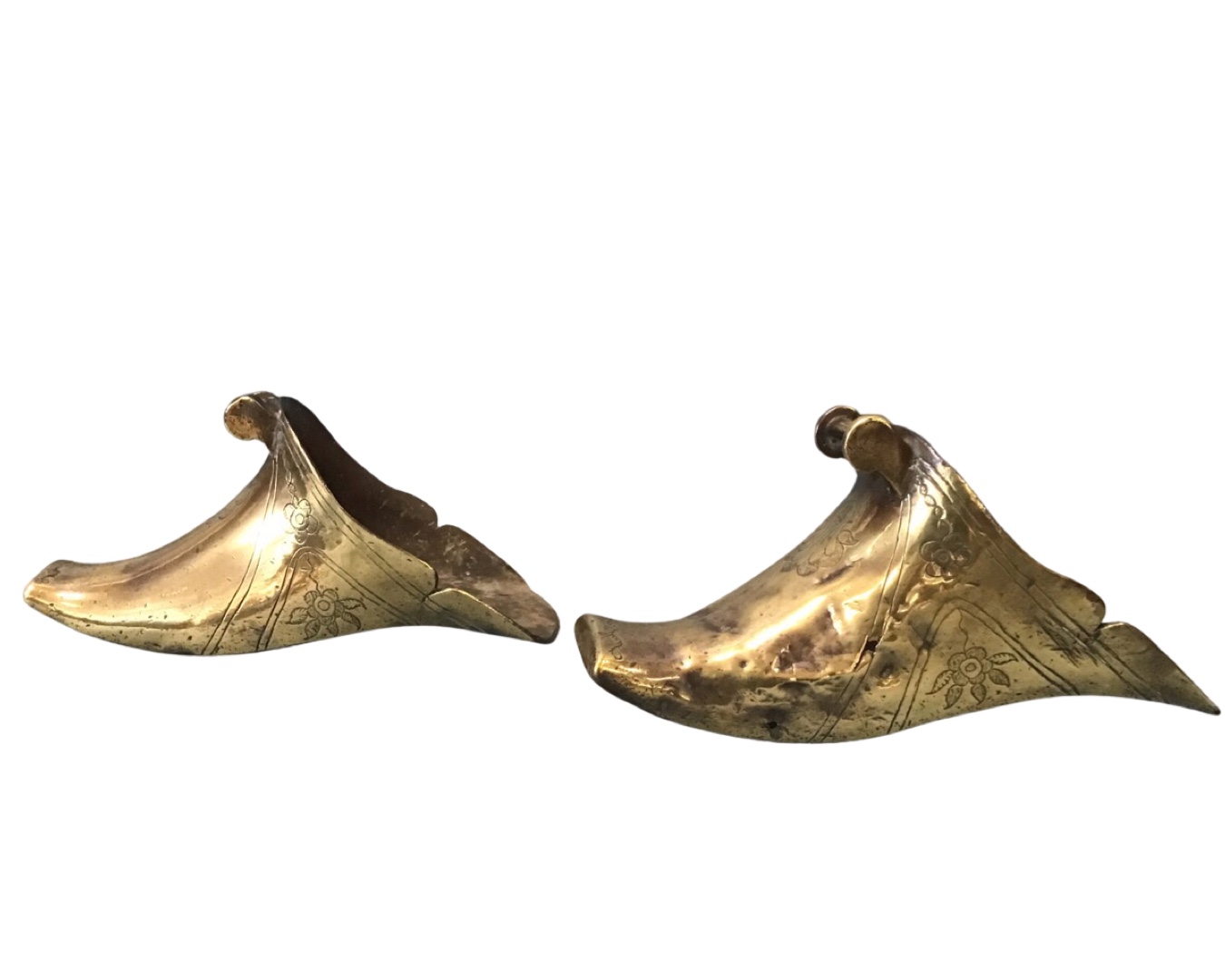 A pair of antique brass slipper stirrups, probably Spanish with floral engraved decoration, the