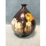 An ovoid Doulton terracotta Holbein glazed vase with tapering neck and flared rim, decorated with