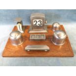 A 30s desk tidy on rectangular oak chequer inlaid stand, with postal scales, date calendar, spring