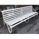 A long 8ft C20th wrought iron garden bench with curved slatted back & seat on three scrolled riveted