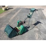 A Qualcast garden petrol lawnmower, the Suffolk Punch 30S model with grassbox and Dellorto engine.