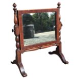 A small nineteenth century mahogany dressing table mirror with rectangular plate in boxwood strung