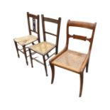 Three cane/rush seated chairs - Victorian on sabre legs, inlaid Edwardian with spade feet, and